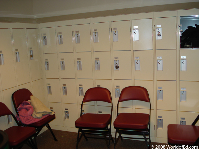 A locker room with a wall of lockers.